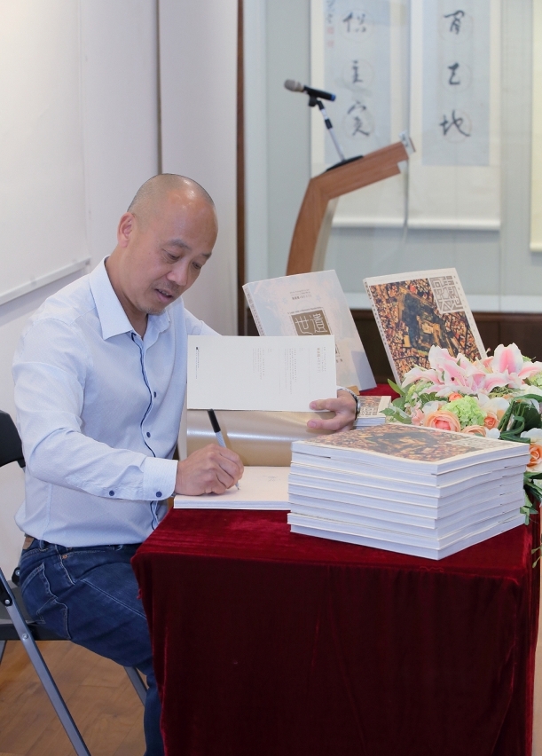 Photographer Chan Hin Io signed for his new book