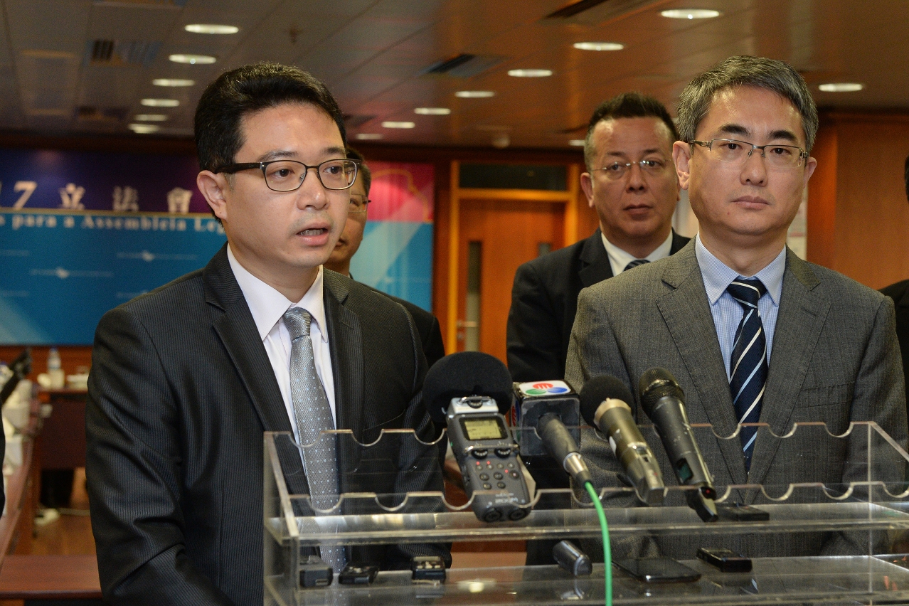The Chairman of the Electoral Affairs Commission for the Legislative Assembly Election, Mr Tong Hio Fong (left), meets the press after a meeting with the Commission Against Corruption.