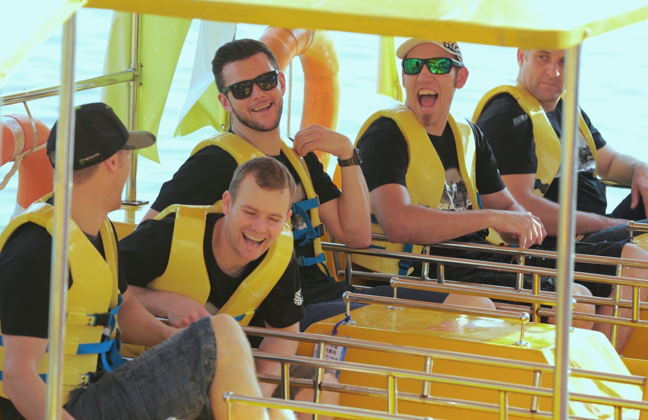Drivers and riders enjoy the boat ride.