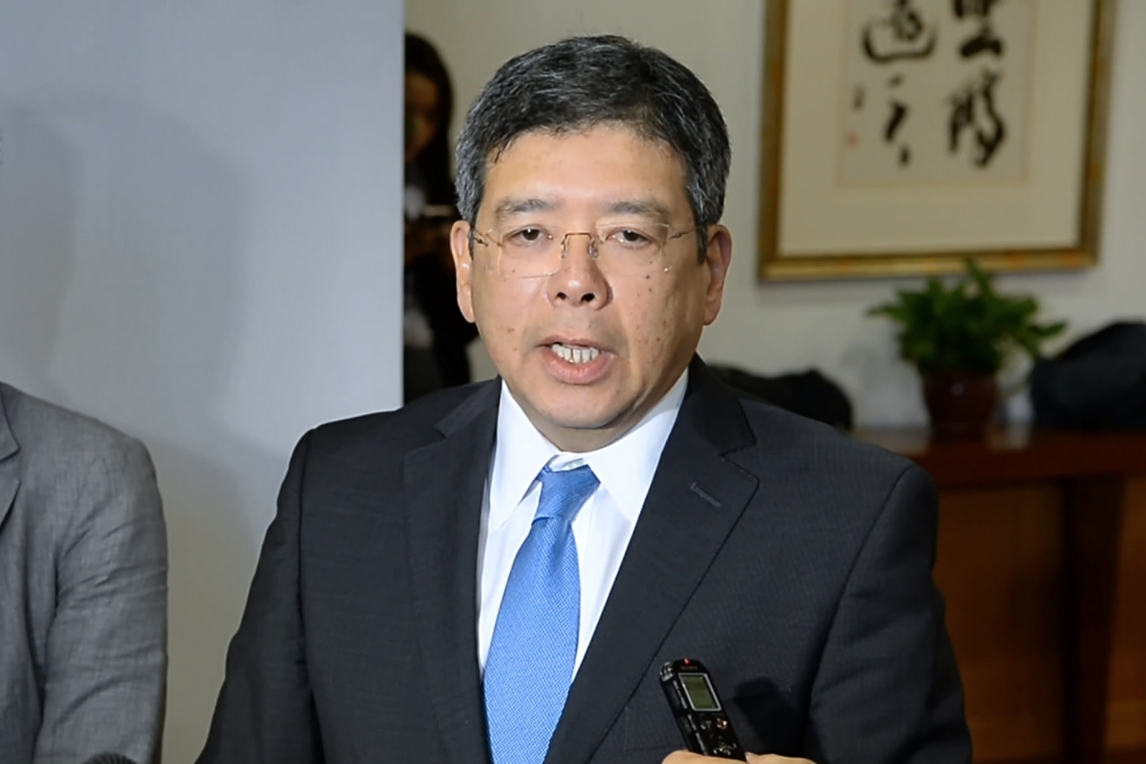 The Secretary for Transport and Public Works, Mr Raimundo do Rosário, speaks to reporters.