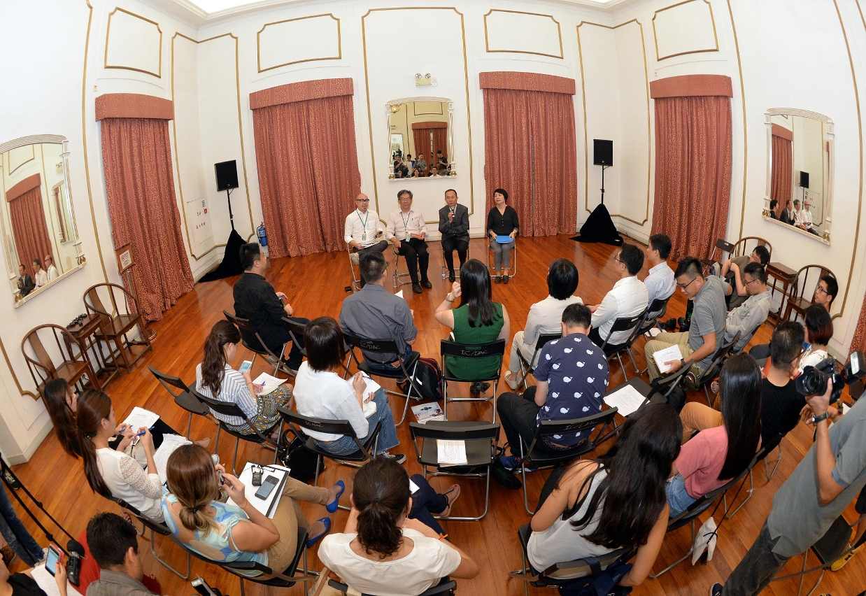 Representatives of the Cultural Affairs Bureau speak to  at the session with the press regarding enhanced protection of heritage buildings.