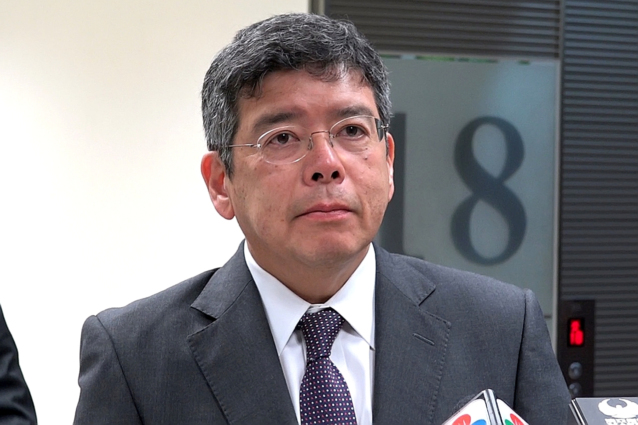 Secretary for Transport and Public Works, Mr Raimundo do Rosário, speaks to reporters.
