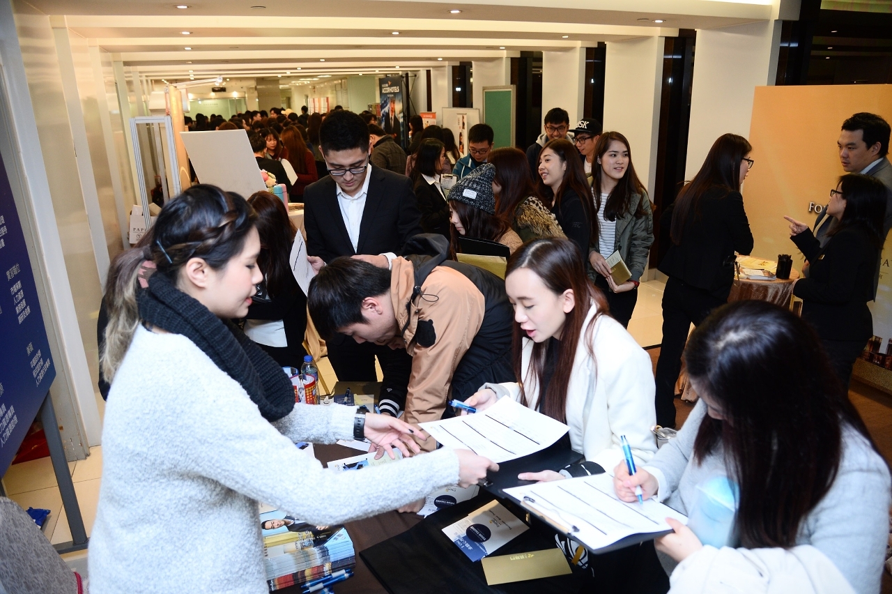 Students enthusiastically enquiring about job opportunities.