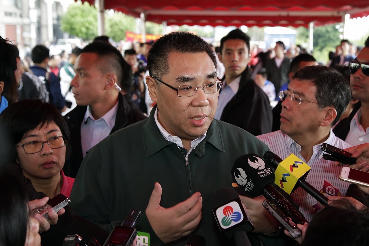 Chief Executive, Mr Chui Sai On, speaks to reporters.