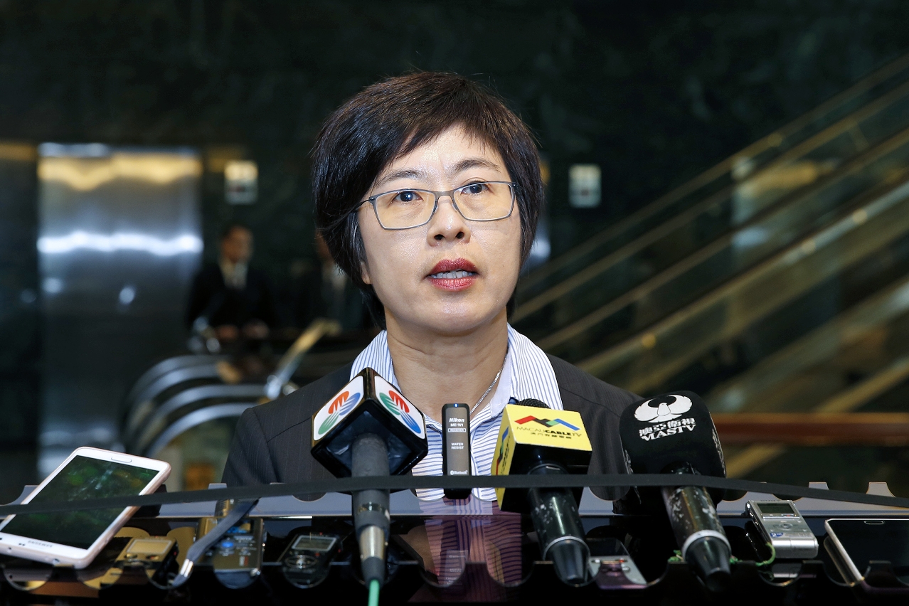 Secretary for Administration and Justice, Ms Chan Hoi Fan, talks to the press in the same occasion.