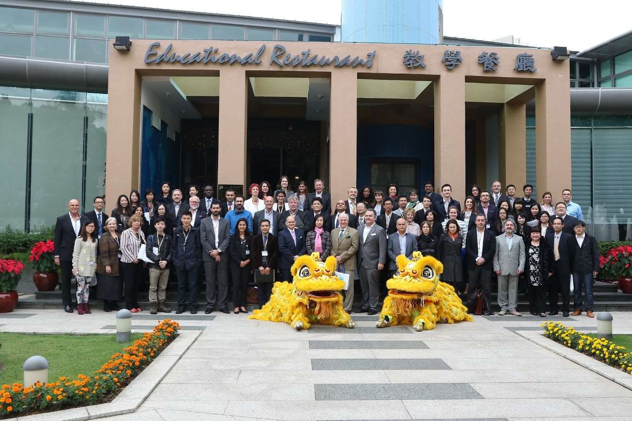 Conference delegates taking group photo after the lion dance performance as a welcome ceremony