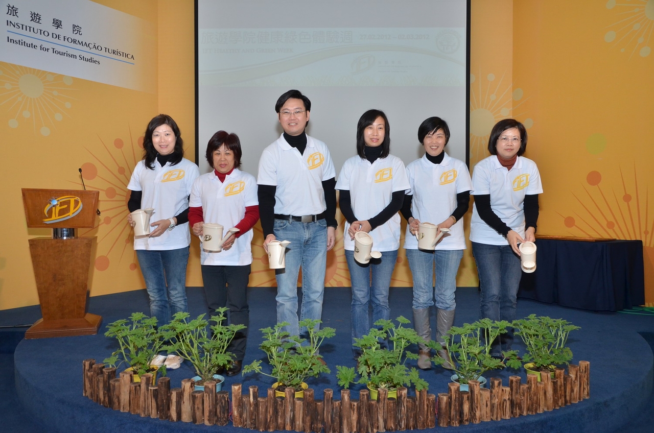 Officiating guests watering the plants for the opening ceremony of the Healthy and Green Week. (Left 1) Mrs. Diamantina Coimbra, Director of Tourism and Hotel School, (Left 2) Ms. Monie Kuok, Functional Head of Tertiary Education Services Office , (Left 3) Mr. Cheong Sio Kei, Director of Environmental Protection Bureau, (Left 4) Dr. Fanny Vong, President of IFT, (Left 5) Ms. Gloria Wong, Secretary-General of Tourism Development Committee, (Left 6)Ms. Florence Ian, Vice-president of IFT