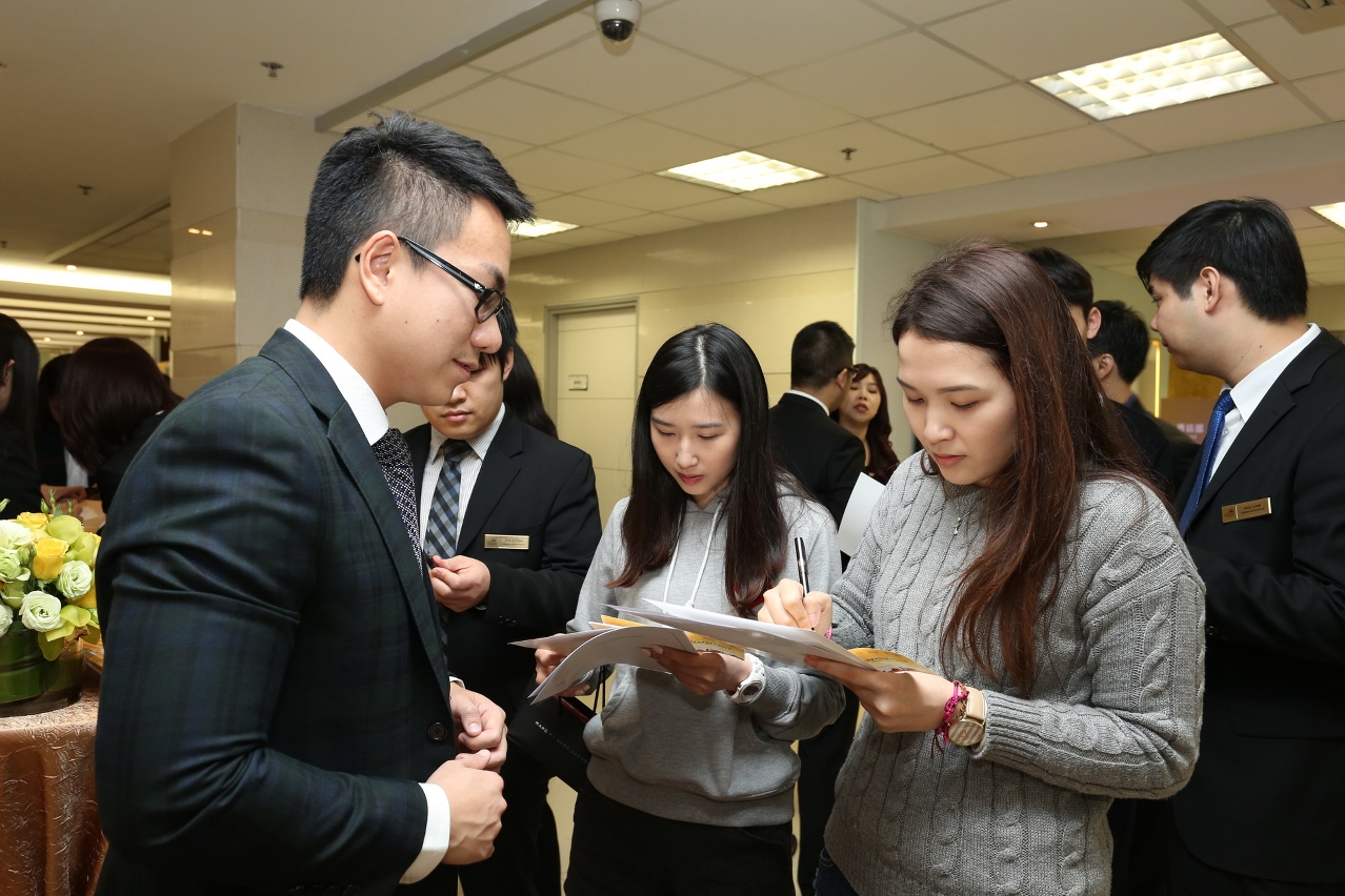 Students enthusiastically enquiring about career opportunities.