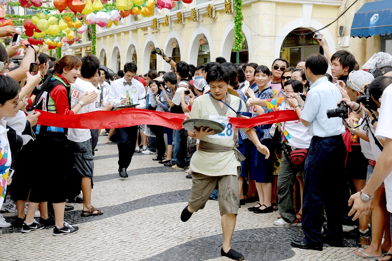 Macau waiters and waitresses at World Tourism Day tray race